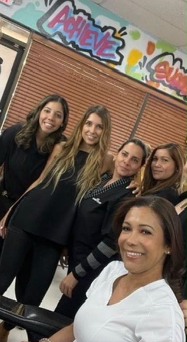 Silvia with cosmetology students and instructors