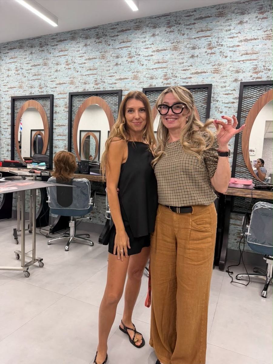 Silvia Lavy with a stylist at a beauty school