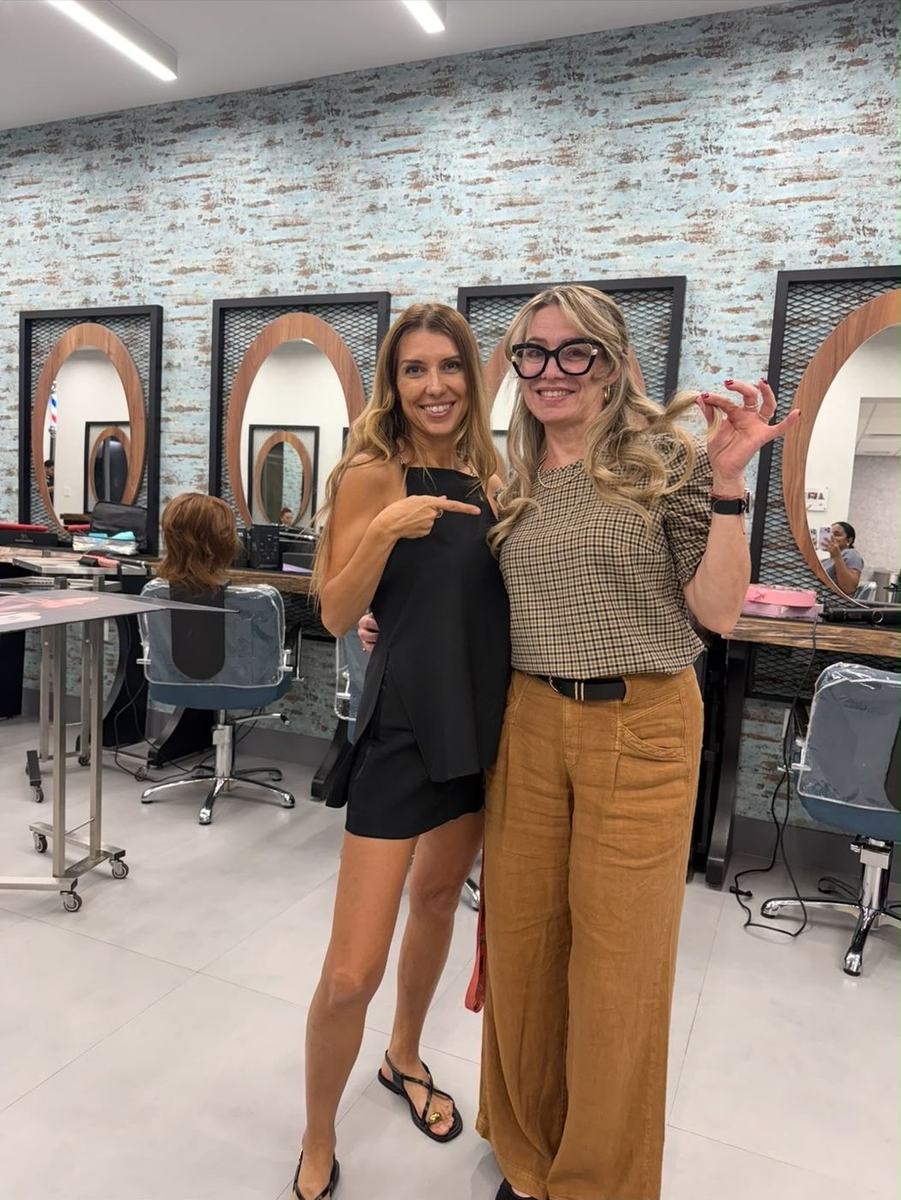 Silvia Lavy with a stylist at a beauty school